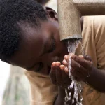 kid drinking from tape